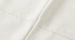 secures neckline seam edges